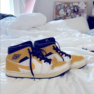 Yellow and White High-Top Sneakers Nike Air Jordan’s